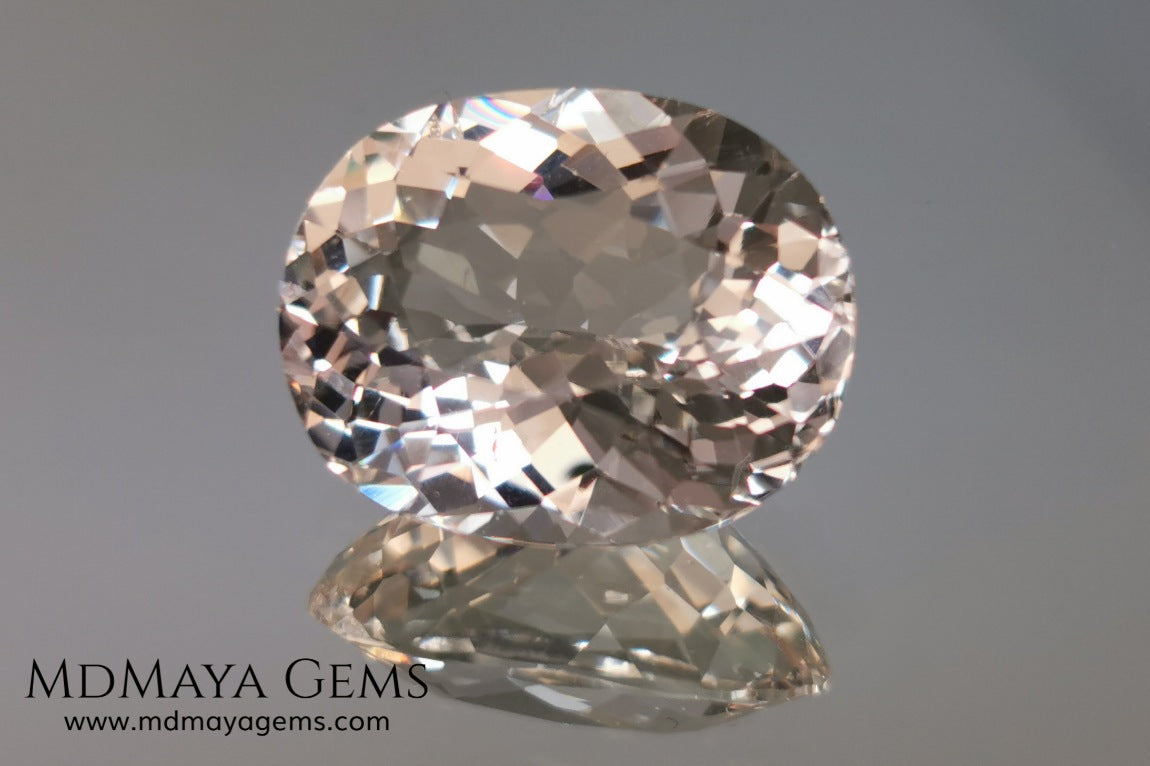 Light Peach Morganite. Oval Cut. 11.98 ct.  This morganite has a very light pale peach color, it is a natural gem of large size, beautiful proportions and great brilliance, it has a small fracture in the pavilion, but that does not affect the beauty of the gem. Once mounted on any piece of jewelry it will be spectacular and the best price. A great gem within the reach of any pocket.