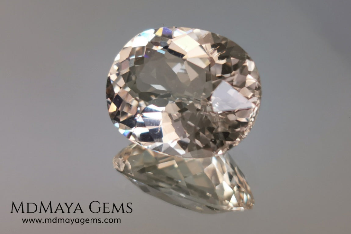 Light Peach Morganite. Oval Cut. 11.98 ct.  This morganite has a very light pale peach color, it is a natural gem of large size, beautiful proportions and great brilliance, it has a small fracture in the pavilion, but that does not affect the beauty of the gem. Once mounted on any piece of jewelry it will be spectacular and the best price. A great gem within the reach of any pocket.