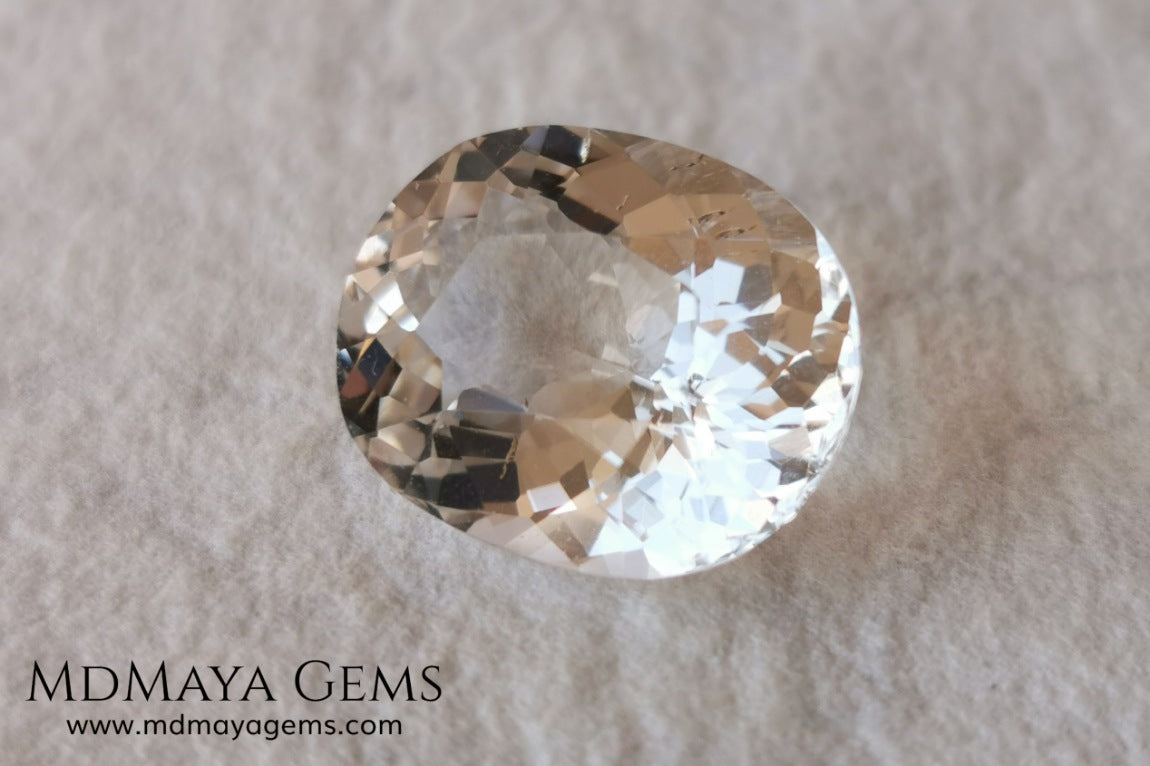 Light Peach Morganite. Oval Cut. 11.98 ct.  This morganite has a very light pale peach color, it is a natural gem of large size, beautiful proportions and great brilliance, it has a small fracture in the pavilion, but that does not affect the beauty of the gem. Once mounted on any piece of jewelry it will be spectacular and the best price. A great gem within the reach of any pocket.