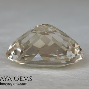 Light Peach Morganite. Oval Cut. 11.98 ct.  This morganite has a very light pale peach color, it is a natural gem of large size, beautiful proportions and great brilliance, it has a small fracture in the pavilion, but that does not affect the beauty of the gem. Once mounted on any piece of jewelry it will be spectacular and the best price. A great gem within the reach of any pocket.