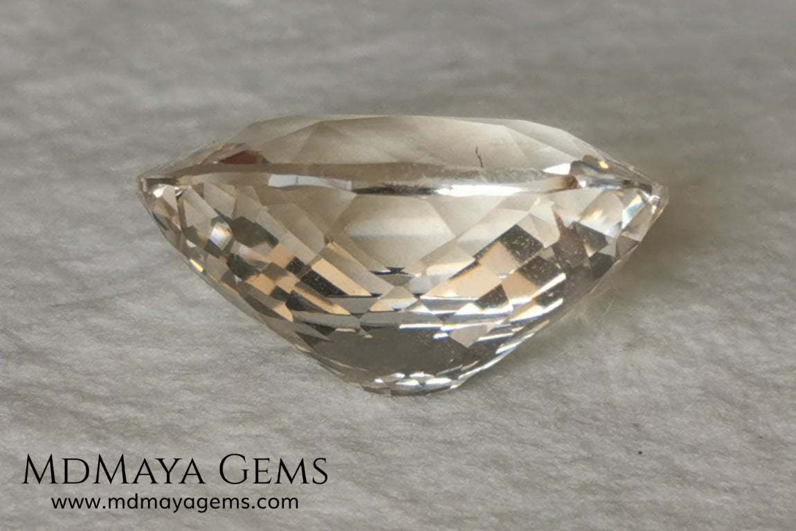 Light Peach Morganite. Oval Cut. 11.98 ct.  This morganite has a very light pale peach color, it is a natural gem of large size, beautiful proportions and great brilliance, it has a small fracture in the pavilion, but that does not affect the beauty of the gem. Once mounted on any piece of jewelry it will be spectacular and the best price. A great gem within the reach of any pocket.