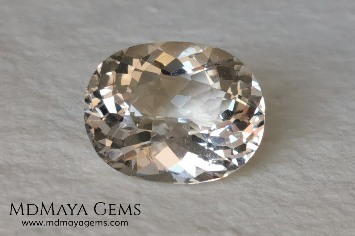 Light Peach Morganite. Oval Cut. 11.98 ct.  This morganite has a very light pale peach color, it is a natural gem of large size, beautiful proportions and great brilliance, it has a small fracture in the pavilion, but that does not affect the beauty of the gem. Once mounted on any piece of jewelry it will be spectacular and the best price. A great gem within the reach of any pocket.