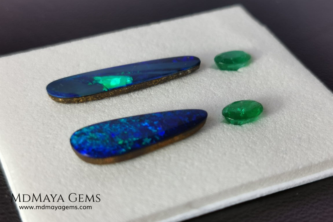  Opal Doublets and Emeralds. This set is composed by a pair of bright Australian Opal doublet and two vivid Zambian Emeralds. The perfect combination for your bespoke jewelry. 