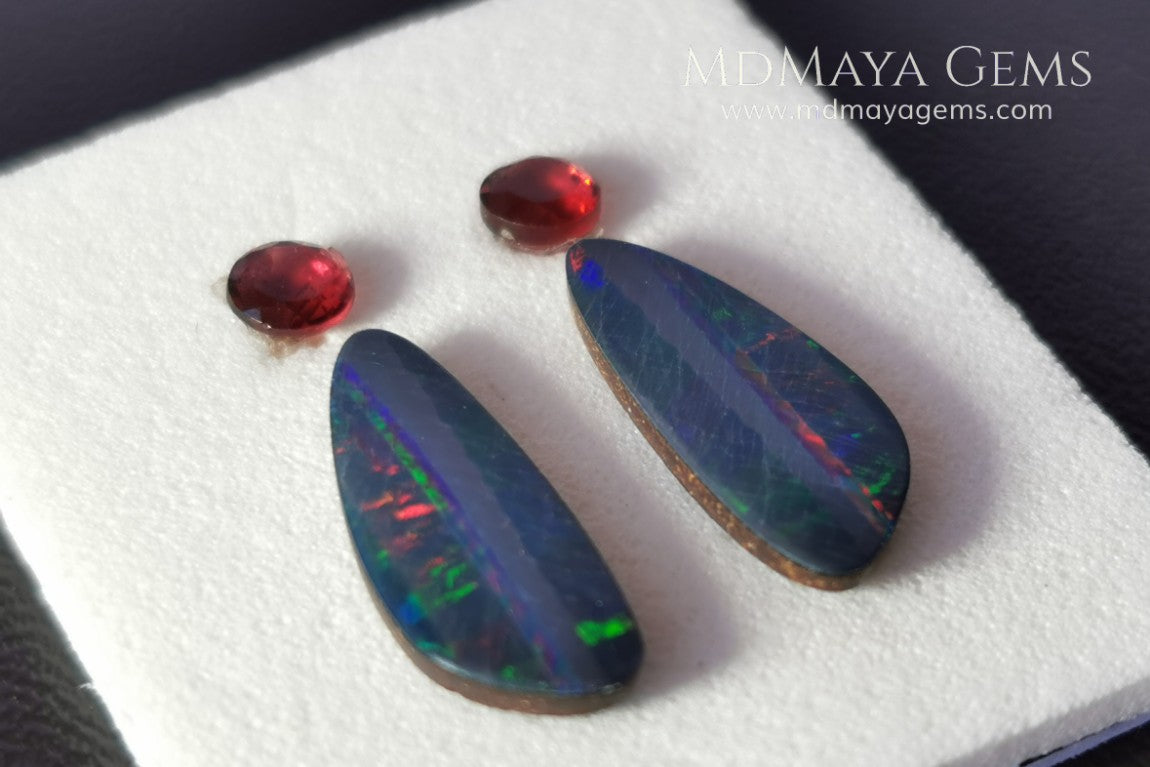 Opal Doublets and Red Garnets. This set is composed by a pair of bright Australian Opal doublet and two vivid Garnets. The perfect combination for your bespoke jewelry. 