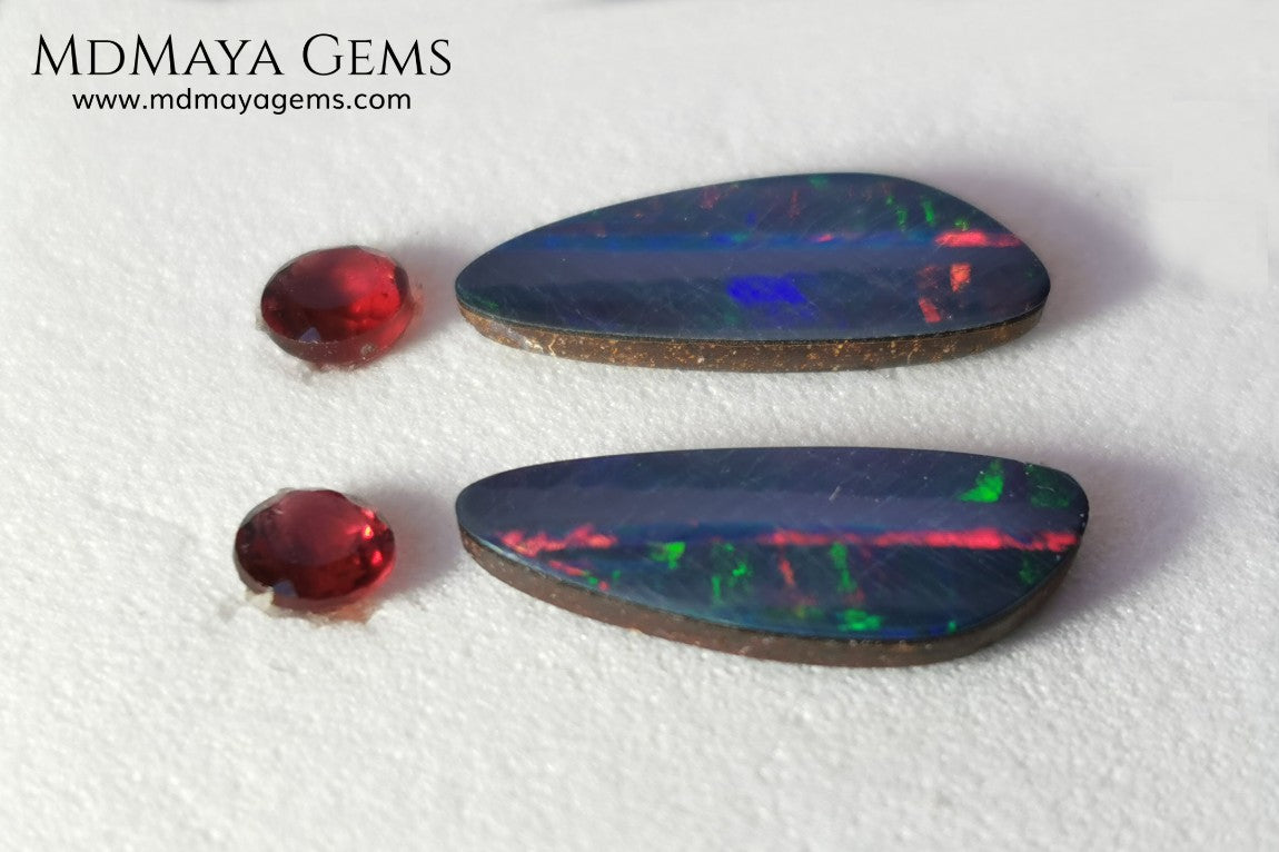 Opal Doublets and Red Garnets. This set is composed by a pair of bright Australian Opal doublet and two vivid Garnets. The perfect combination for your bespoke jewelry. 