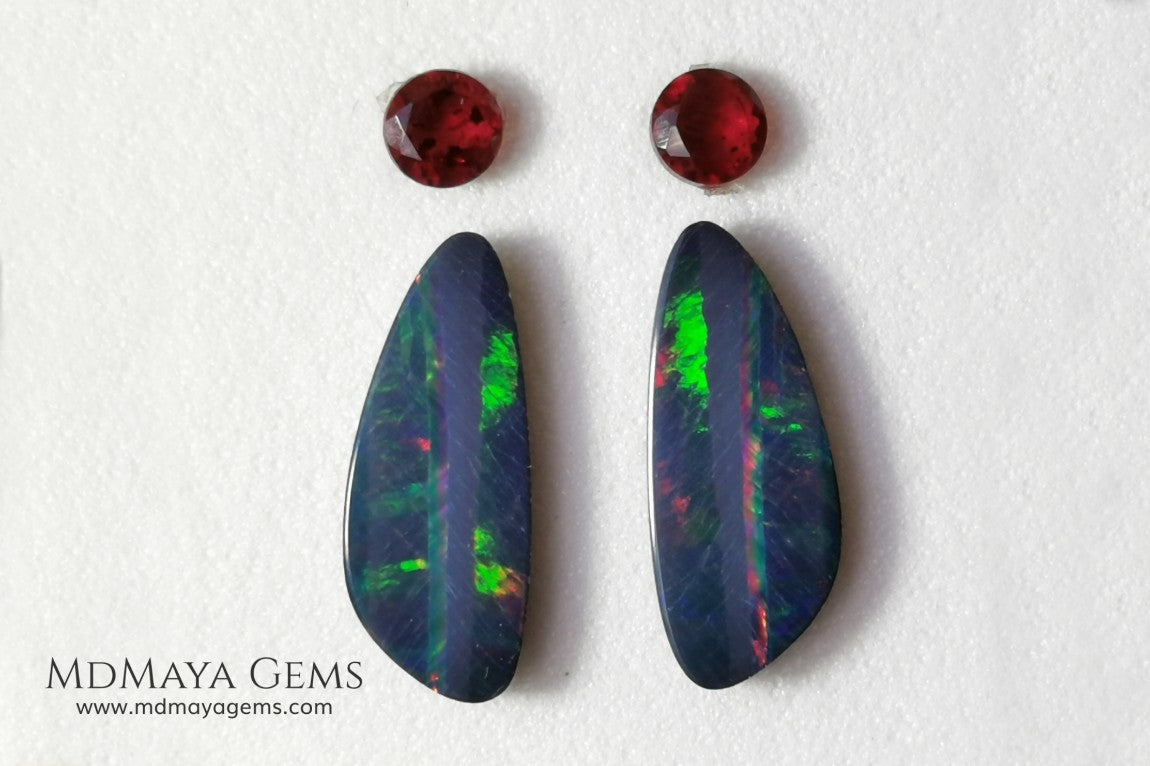 Opal Doublets and Red Garnets. This set is composed by a pair of bright Australian Opal doublet and two vivid Garnets. The perfect combination for your bespoke jewelry. 