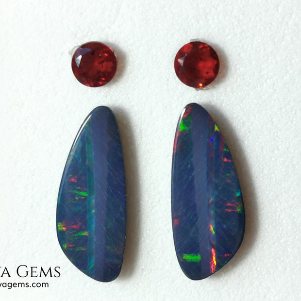 Opal Doublets and Red Garnets. This set is composed by a pair of bright Australian Opal doublet and two vivid Garnets. The perfect combination for your bespoke jewelry. 