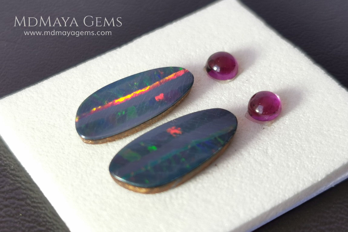 Opal Doublets and Umbalite Garnets. This set is composed by a pair of bright Australian Opal doublet and two vivid Umbalites. The perfect combination for your bespoke jewelry.