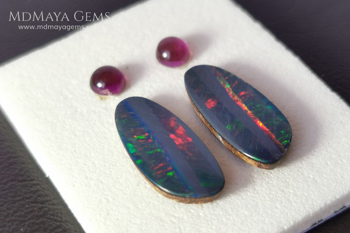 Opal Doublets and Umbalite Garnets. This set is composed by a pair of bright Australian Opal doublet and two vivid Umbalites. The perfect combination for your bespoke jewelry.