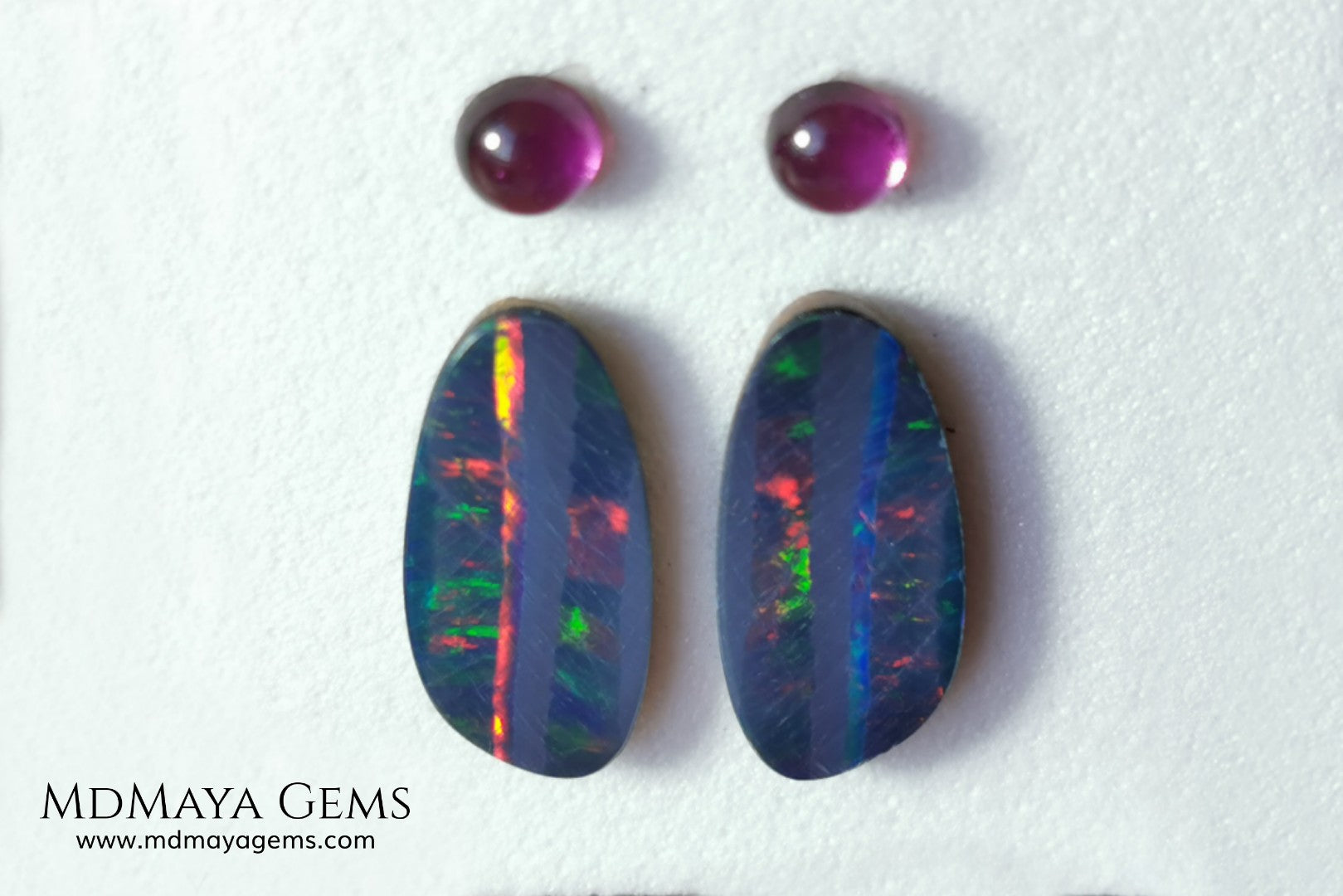 Opal Doublets and Umbalite Garnets. This set is composed by a pair of bright Australian Opal doublet and two vivid Umbalites. The perfect combination for your bespoke jewelry.