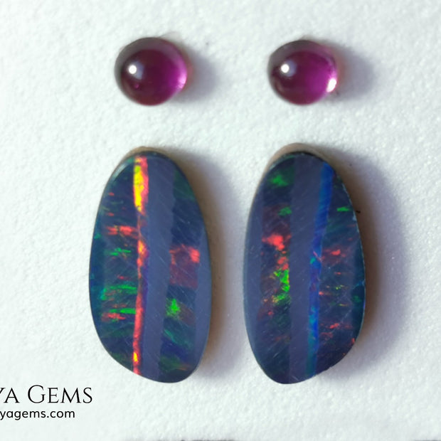 Opal Doublets and Umbalite Garnets. This set is composed by a pair of bright Australian Opal doublet and two vivid Umbalites. The perfect combination for your bespoke jewelry.