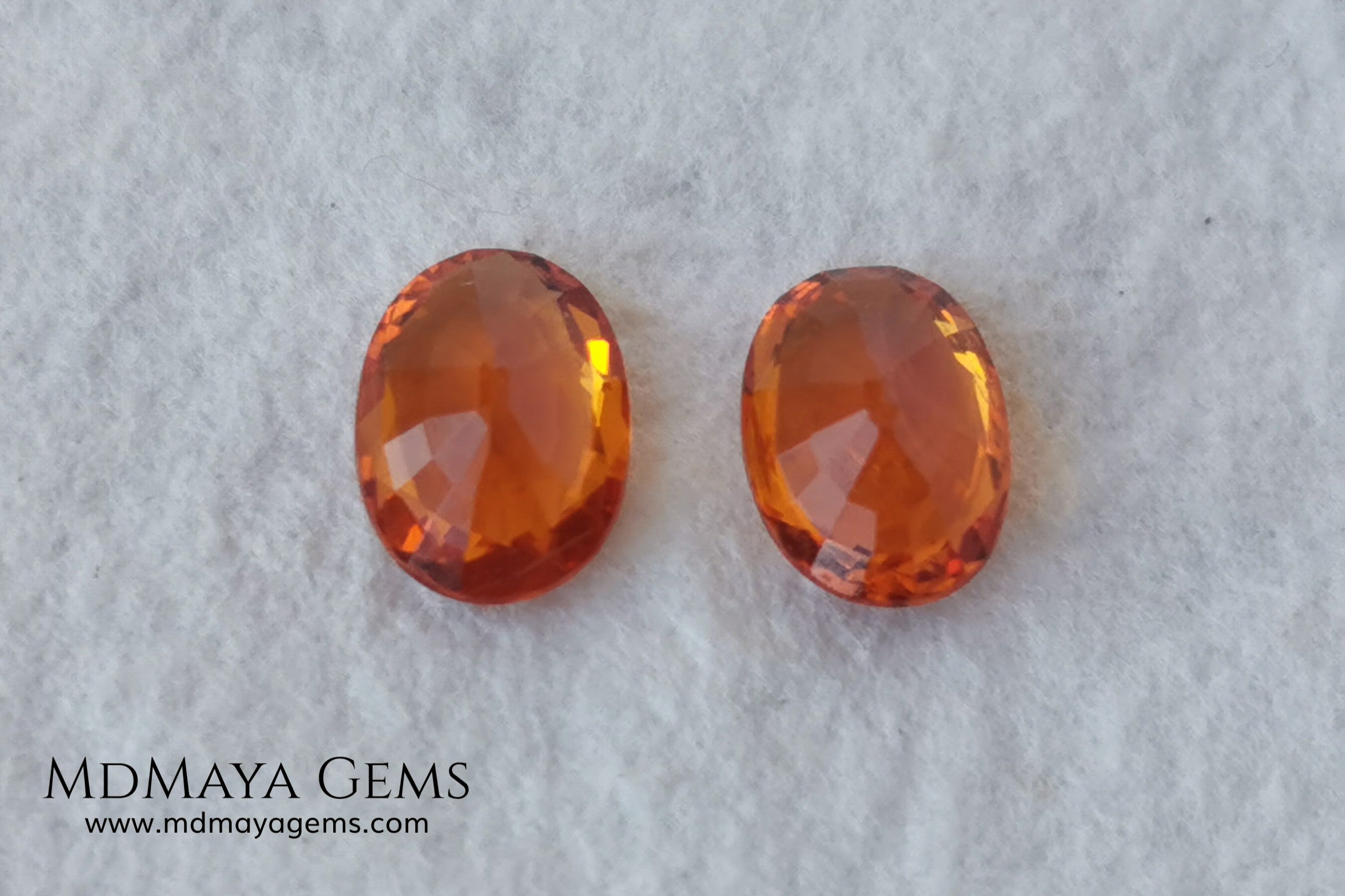  Pair Mandarin Garnet. Oval Cut. 1.82 ct total. Stunning and Bright Orange Spessartite Garnets. Beautiful pair of natural and untreated gemstones, they will be superb on some earrings. They are full of life, they are pure orange. Don't miss it!