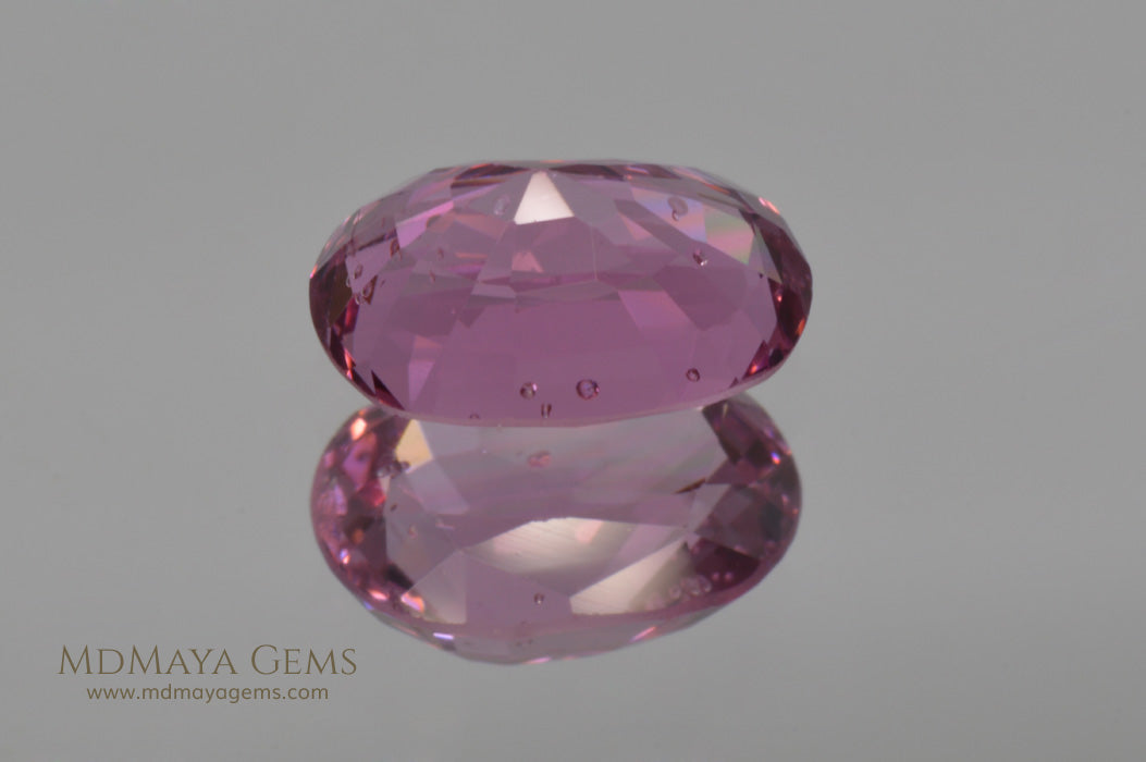 Pavilion Pink Burmese Spinel Oval cut 2.44 ct under fluorescent light