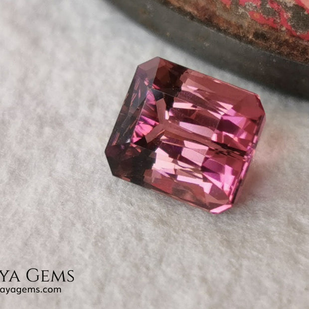 Beautiful Bi Color Pink - Orange Tourmaline. Octagon Cut. 1.47 ct. Eye Clean and Perfect Cut.  Two-tone pink tourmaline, this gemstone shows two shades, one duller and the other more saturated and alive, depending on how it moves under the light you can see its different shades.