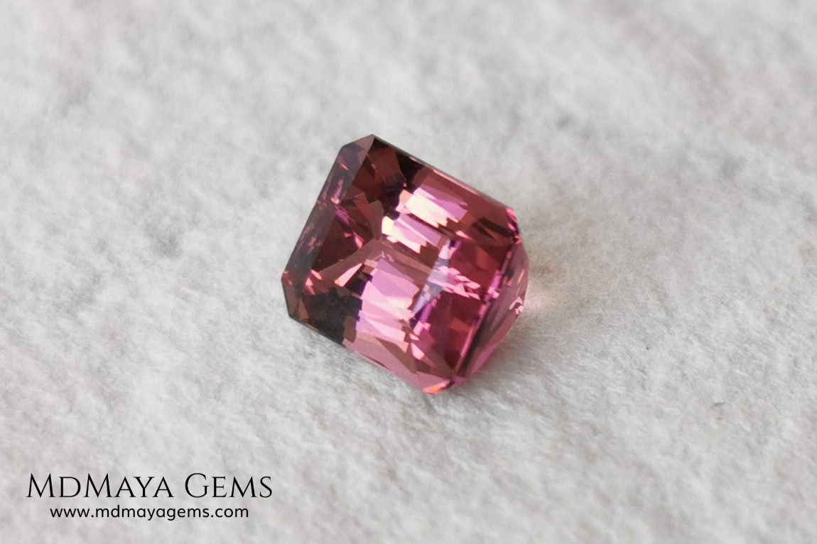 Beautiful Bi Color Pink - Orange Tourmaline. Octagon Cut. 1.47 ct. Eye Clean and Perfect Cut.  Two-tone pink tourmaline, this gemstone shows two shades, one duller and the other more saturated and alive, depending on how it moves under the light you can see its different shades.