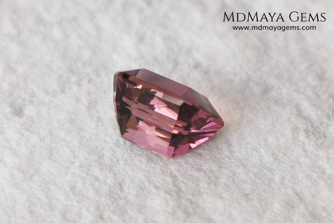 Beautiful Bi Color Pink - Orange Tourmaline. Octagon Cut. 1.47 ct. Eye Clean and Perfect Cut.  Two-tone pink tourmaline, this gemstone shows two shades, one duller and the other more saturated and alive, depending on how it moves under the light you can see its different shades.