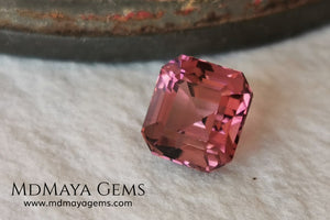 Reddish Pink tourmaline. Asscher cut - Square 6 mm. 1.45 ct.  Beautiful pink tourmaline, with great bright and saturation. It has a great quality of cut, very well proportioned. Its behavior under any type of light is very good. Looking gorgeous under any type of lighting. It would look perfect on an engagement ring or any jewel you can imagine. A great gem at a low price.
