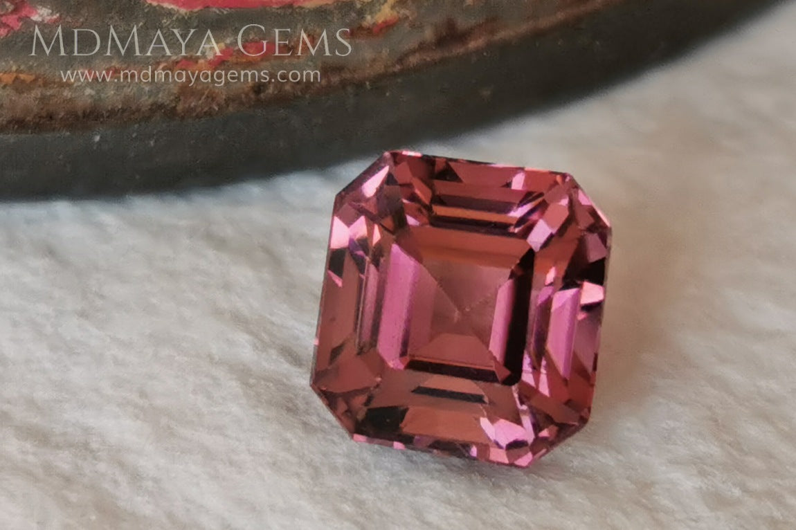 Reddish Pink tourmaline. Asscher cut - Square 6 mm. 1.45 ct.  Beautiful pink tourmaline, with great bright and saturation. It has a great quality of cut, very well proportioned. Its behavior under any type of light is very good. Looking gorgeous under any type of lighting. It would look perfect on an engagement ring or any jewel you can imagine. A great gem at a low price.