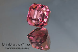 Reddish pink tourmaline. Asscher cut. 2.65 ct. This natural gemstone has a very saturated reddish-pink color, along with its beautiful cut and size, it will be look amazing in a ring. A great gem.