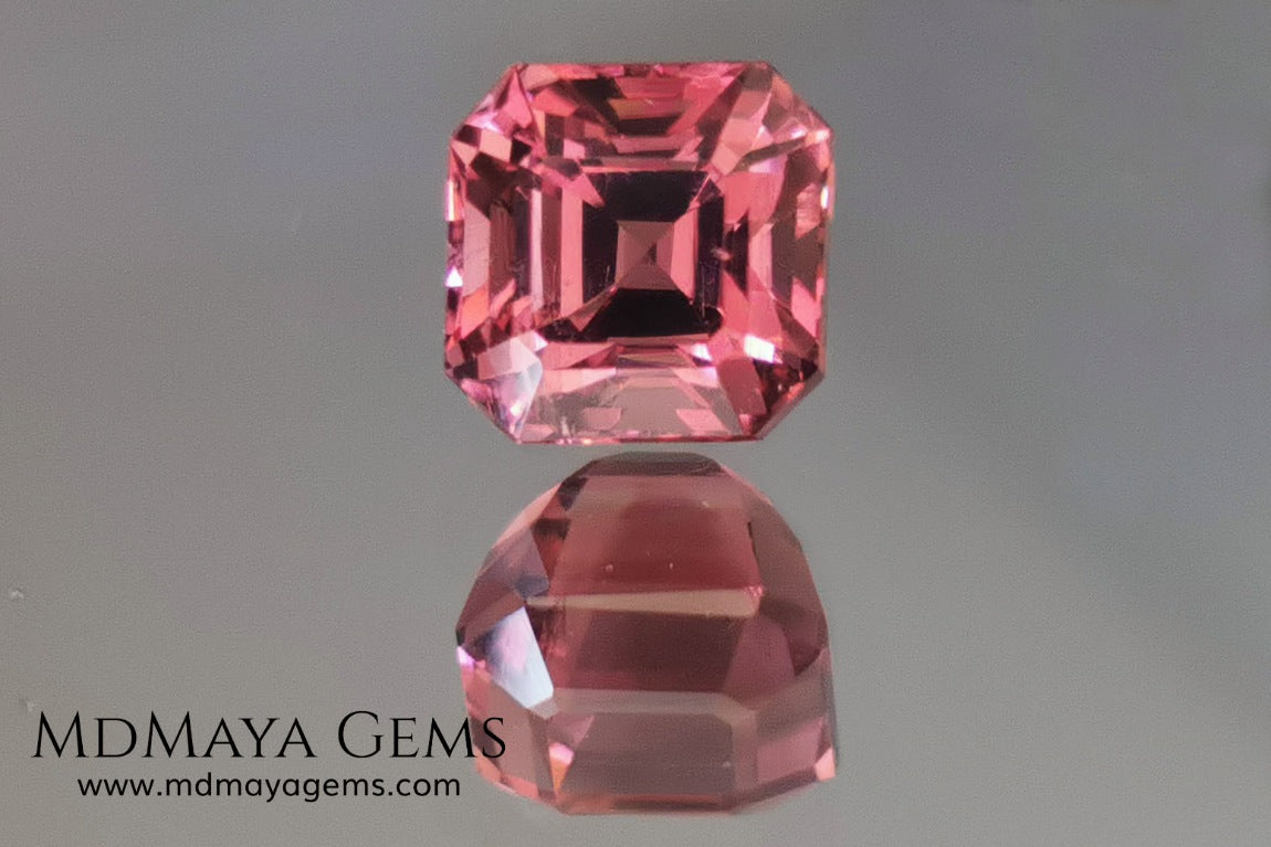Reddish pink tourmaline. Asscher cut. 2.65 ct. This natural gemstone has a very saturated reddish-pink color, along with its beautiful cut and size, it will be look amazing in a ring. A great gem.