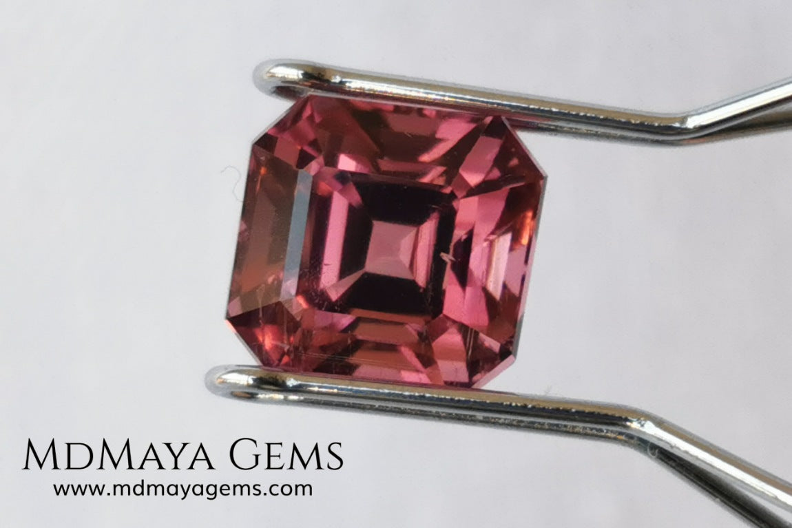 Reddish pink tourmaline. Asscher cut. 2.65 ct. This natural gemstone has a very saturated reddish-pink color, along with its beautiful cut and size, it will be look amazing in a ring. A great gem.