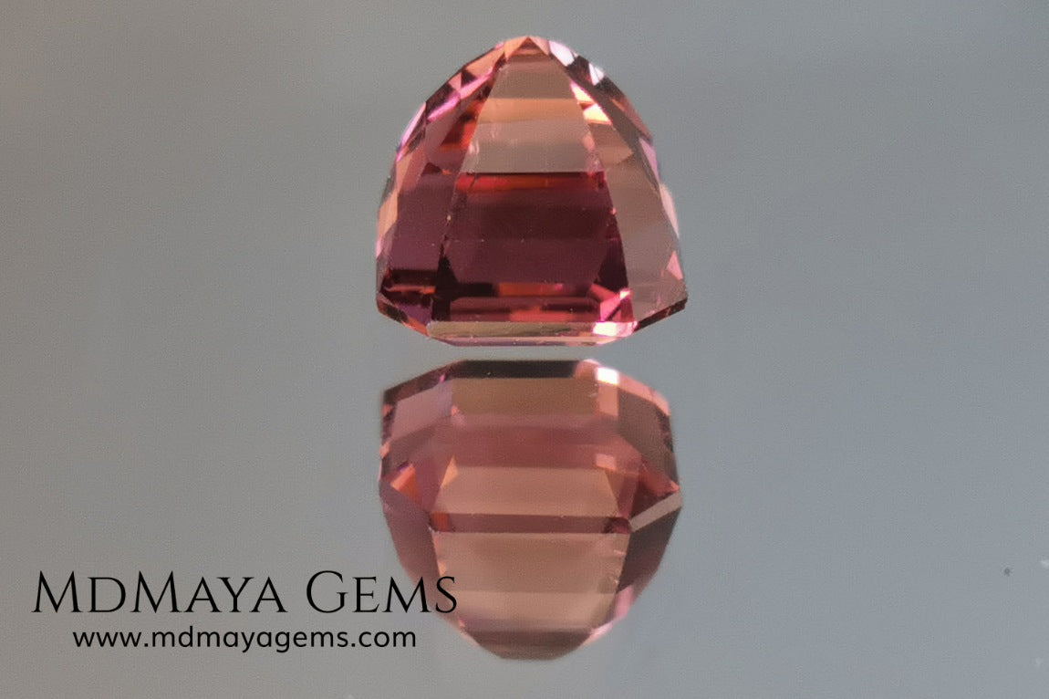 Reddish pink tourmaline. Asscher cut. 2.65 ct. This natural gemstone has a very saturated reddish-pink color, along with its beautiful cut and size, it will be look amazing in a ring. A great gem.
