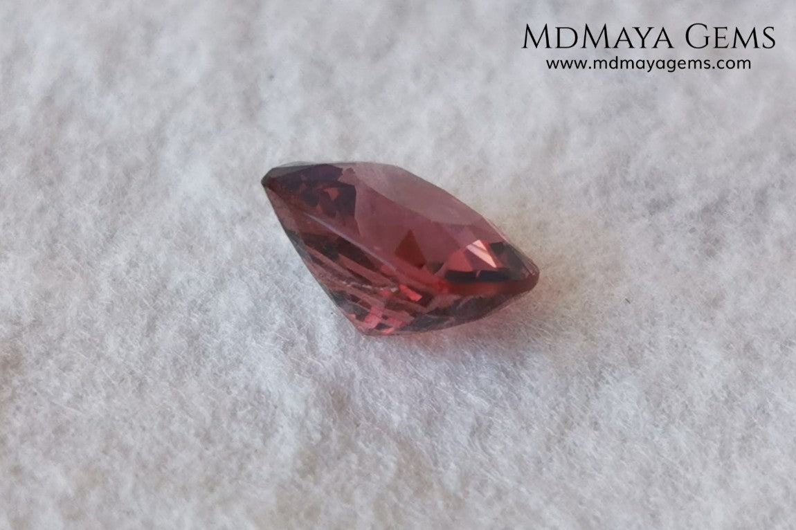 Red - Orange Spinel. Cushion Cut. 1.11 cts. Beautiful untreated gem for your personalized jewelry. This beautiful spinel is so inexpensively priced due to a fracture in the pavilion, it is not visible and does not affect the beauty of the gem at all.
