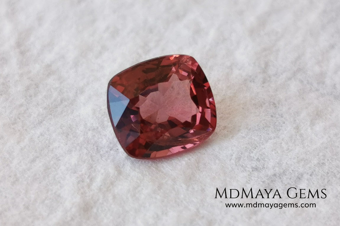 Red - Orange Spinel. Cushion Cut. 1.11 cts. Beautiful untreated gem for your personalized jewelry. This beautiful spinel is so inexpensively priced due to a fracture in the pavilion, it is not visible and does not affect the beauty of the gem at all.