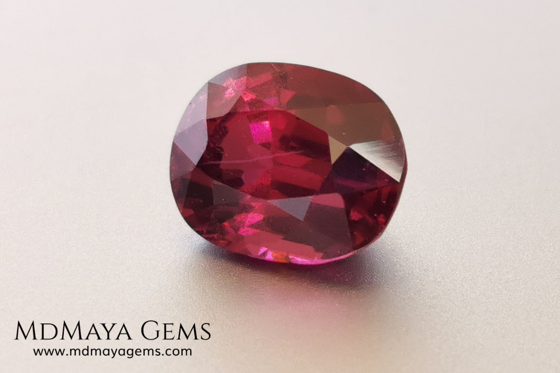 Vivid reddish purple rhodolite garnet. Oval cut, 3.87 ct.  This beauty has a story behind it, it came into my hands like a rubellite, when I analyzed it I saw that it was a garnet and not a tourmaline, I did not return it, since it has a beautiful color, very saturated, a good size and proportions, it has a very small nick in the girdle, but I'm sure it will look beautiful in any piece of jewelry you can imagine, yes, like a rhodolite garnet.