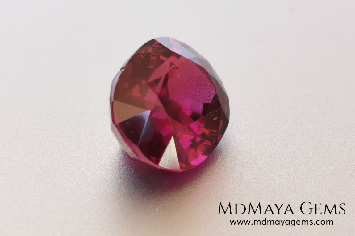 Vivid reddish purple rhodolite garnet. Oval cut, 3.87 ct.  This beauty has a story behind it, it came into my hands like a rubellite, when I analyzed it I saw that it was a garnet and not a tourmaline, I did not return it, since it has a beautiful color, very saturated, a good size and proportions, it has a very small nick in the girdle, but I'm sure it will look beautiful in any piece of jewelry you can imagine, yes, like a rhodolite garnet.