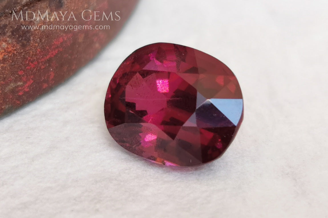 Vivid reddish purple rhodolite garnet. Oval cut, 3.87 ct.  This beauty has a story behind it, it came into my hands like a rubellite, when I analyzed it I saw that it was a garnet and not a tourmaline, I did not return it, since it has a beautiful color, very saturated, a good size and proportions, it has a very small nick in the girdle, but I'm sure it will look beautiful in any piece of jewelry you can imagine, yes, like a rhodolite garnet.