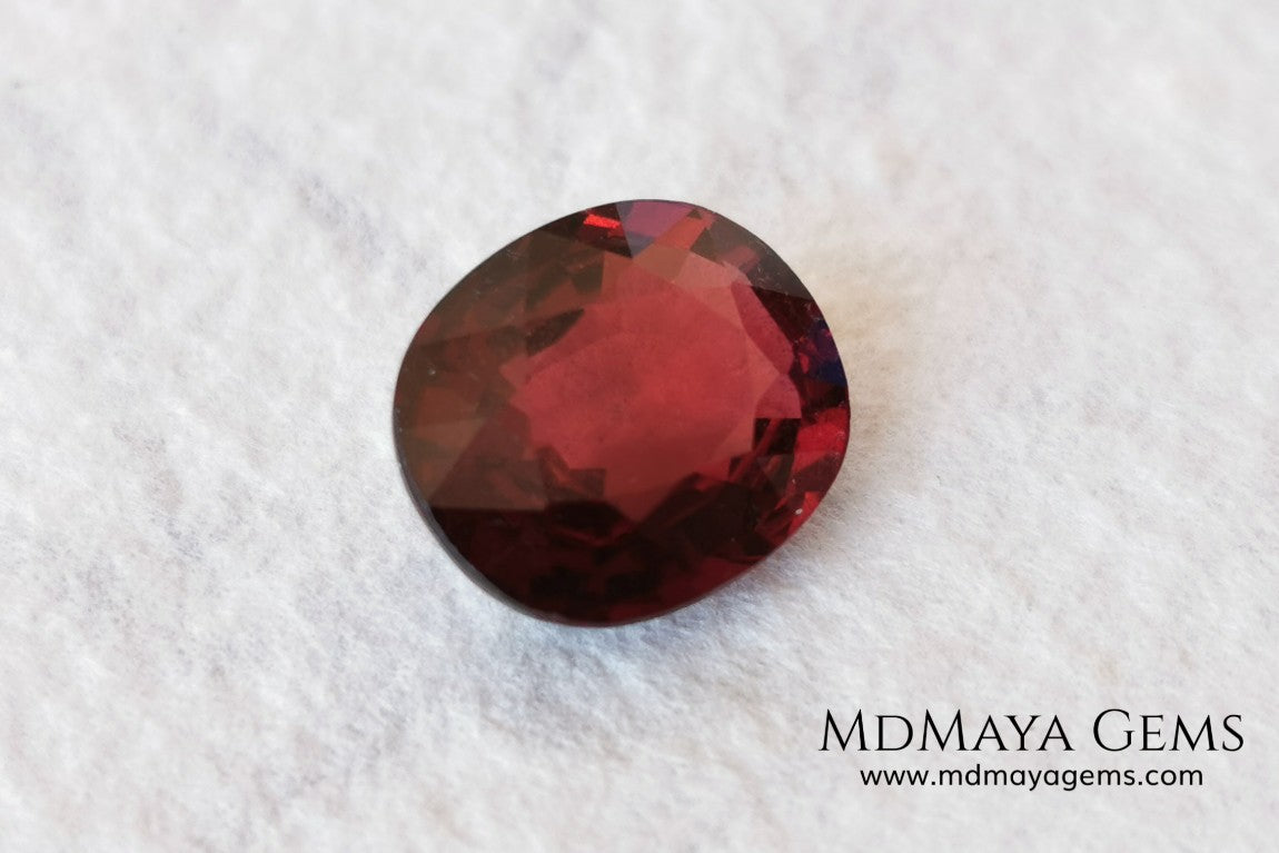 Dark Red Rhodolite, 5.09 ct, oval cut. Elegante dark natural and untreated gemstone. 