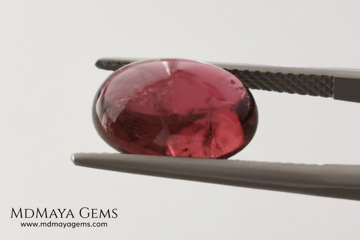 Large tourmaline rubellite, 6.16 ct, oval cabochon cut. Beautiful natural gem ideal for your personalized jewelry. This purplish red cabochon has a good size for a ring. Good price.