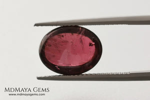 Large tourmaline rubellite, 6.16 ct, oval cabochon cut. Beautiful natural gem ideal for your personalized jewelry. This purplish red cabochon has a good size for a ring. Good price.