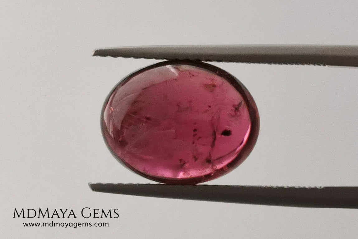 Large tourmaline rubellite, 6.16 ct, oval cabochon cut. Beautiful natural gem ideal for your personalized jewelry. This purplish red cabochon has a good size for a ring. Good price.