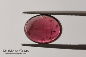 Large tourmaline rubellite, 6.16 ct, oval cabochon cut. Beautiful natural gem ideal for your personalized jewelry. This purplish red cabochon has a good size for a ring. Good price.