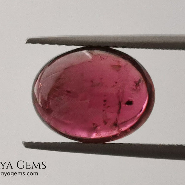 Large tourmaline rubellite, 6.16 ct, oval cabochon cut. Beautiful natural gem ideal for your personalized jewelry. This purplish red cabochon has a good size for a ring. Good price.