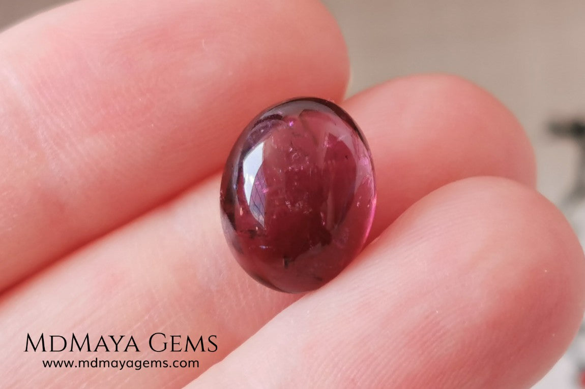 Large tourmaline rubellite, 6.16 ct, oval cabochon cut. Beautiful natural gem ideal for your personalized jewelry. This purplish red cabochon has a good size for a ring. Good price.