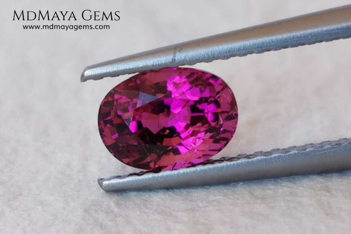Intense Reddish Purple Rubellite 1.21 ct. Oval Cut. African Tourmaline. This gemstone has a saturated pink color. This little gem has the best color of rubellites, under the natural light you can see a very intense pink. It will look fab in a ring, this pink gemstone shines by itself.