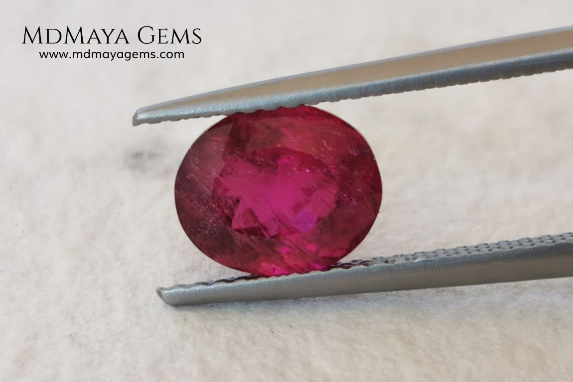Purplish Red Rubellite Tourmaline. Oval Cut. 2.09 ct. This gem has some inclusions but these don't disturb the appearance of the gem, its color is rich and deep under daylight, is awesome!. It is ideal for a ring. 