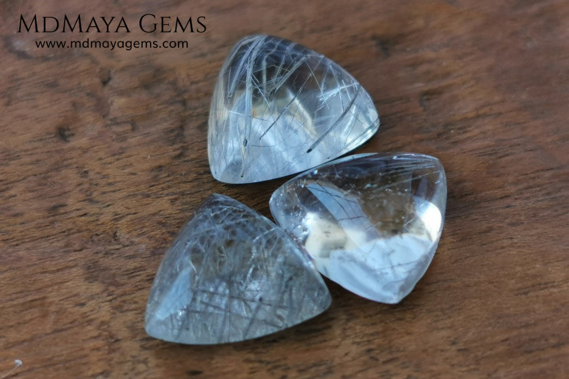 Metallic Rutilated Quartz 9.82 ct set. Outstanding set of rutilated quartz with beautiful inclusions. Perfect for your custom jewelry.  2.73 ct .. 9.93 * 9.83 * 4.73 mm 3.94 ct .. 10.23 * 10.35 * 5.80 mm 3.15 ct .. 9.93 * 9.72 * 5.39 mm