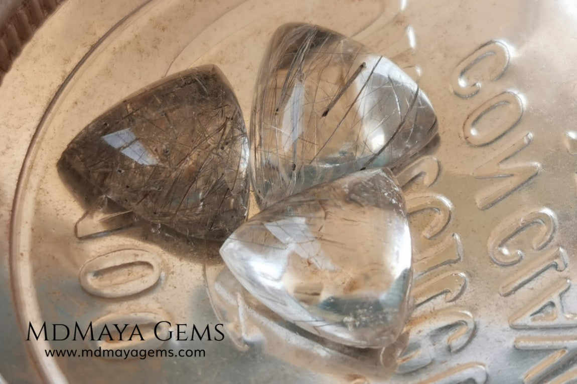 Metallic Rutilated Quartz 9.82 ct set. Outstanding set of rutilated quartz with beautiful inclusions. Perfect for your custom jewelry.  2.73 ct .. 9.93 * 9.83 * 4.73 mm 3.94 ct .. 10.23 * 10.35 * 5.80 mm 3.15 ct .. 9.93 * 9.72 * 5.39 mm