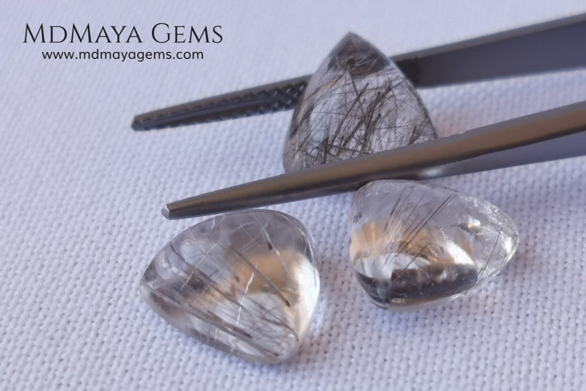 Metallic Rutilated Quartz 9.82 ct set. Outstanding set of rutilated quartz with beautiful inclusions. Perfect for your custom jewelry.  2.73 ct .. 9.93 * 9.83 * 4.73 mm 3.94 ct .. 10.23 * 10.35 * 5.80 mm 3.15 ct .. 9.93 * 9.72 * 5.39 mm