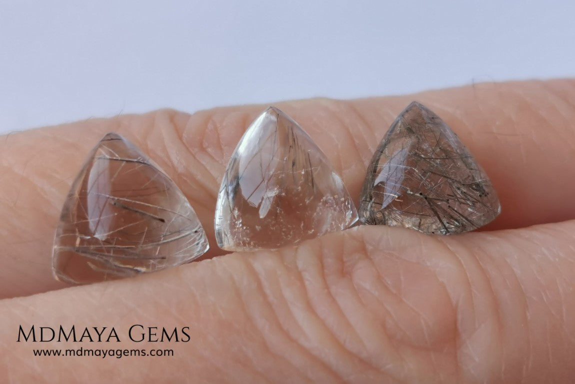 Metallic Rutilated Quartz 9.82 ct set. Outstanding set of rutilated quartz with beautiful inclusions. Perfect for your custom jewelry.  2.73 ct .. 9.93 * 9.83 * 4.73 mm 3.94 ct .. 10.23 * 10.35 * 5.80 mm 3.15 ct .. 9.93 * 9.72 * 5.39 mm