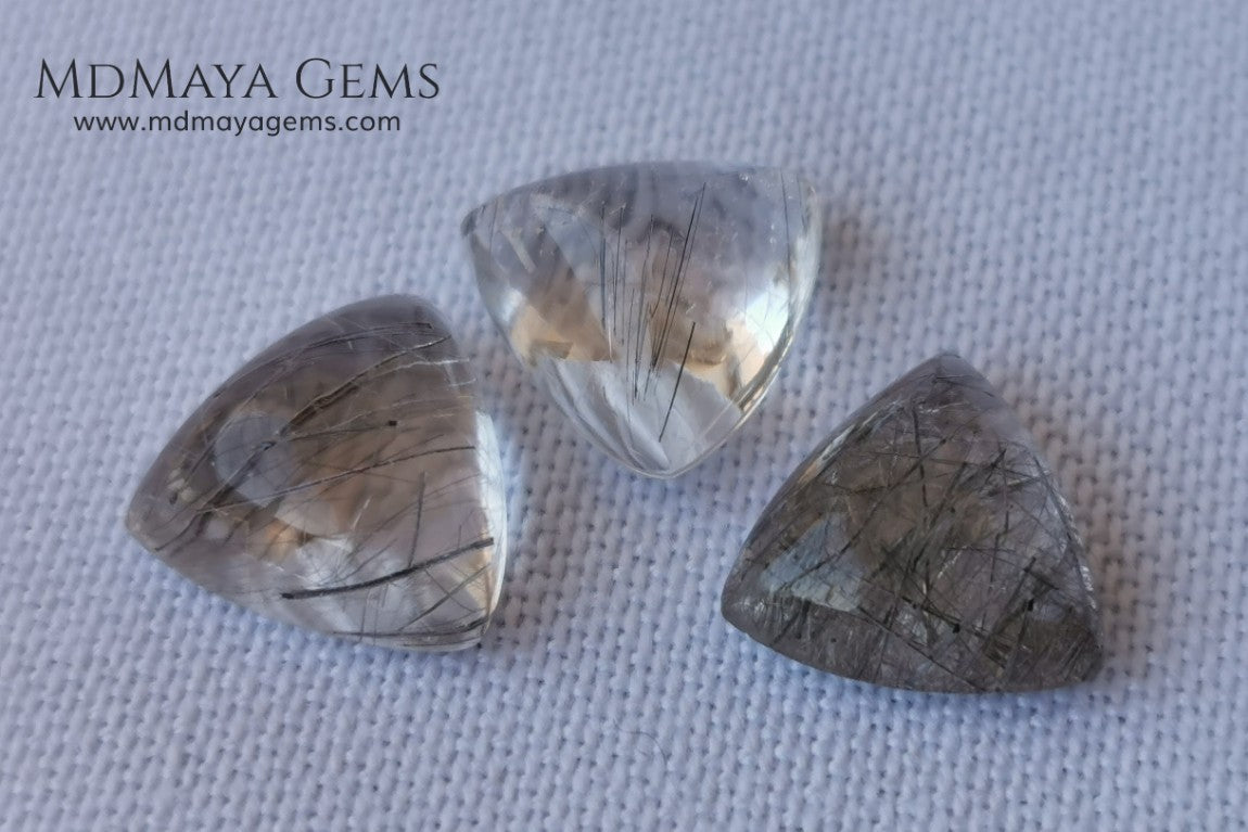 Metallic Rutilated Quartz 9.82 ct set. Outstanding set of rutilated quartz with beautiful inclusions. Perfect for your custom jewelry.  2.73 ct .. 9.93 * 9.83 * 4.73 mm 3.94 ct .. 10.23 * 10.35 * 5.80 mm 3.15 ct .. 9.93 * 9.72 * 5.39 mm