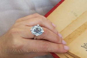 ﻿Luxury Light Blue Topaz and diamond ring in 18k white gold.  