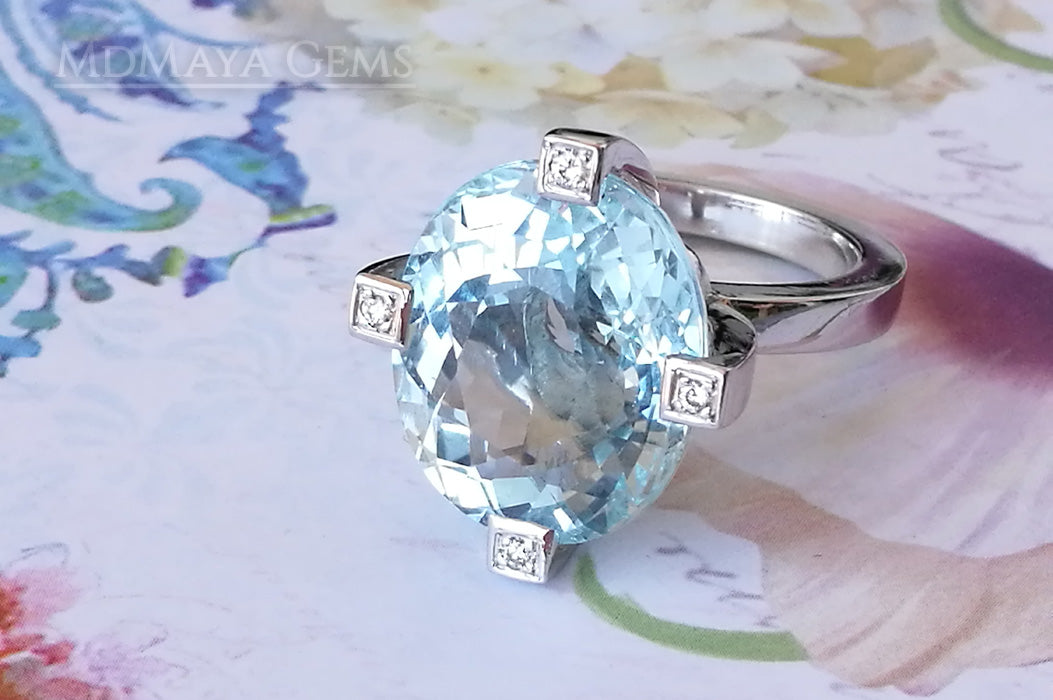 ﻿Luxury Light Blue Topaz and diamond ring in 18k white gold.  