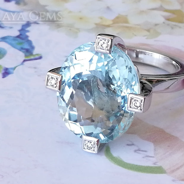 ﻿Luxury Light Blue Topaz and diamond ring in 18k white gold.  