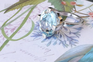 ﻿Luxury Light Blue Topaz and diamond ring in 18k white gold.  