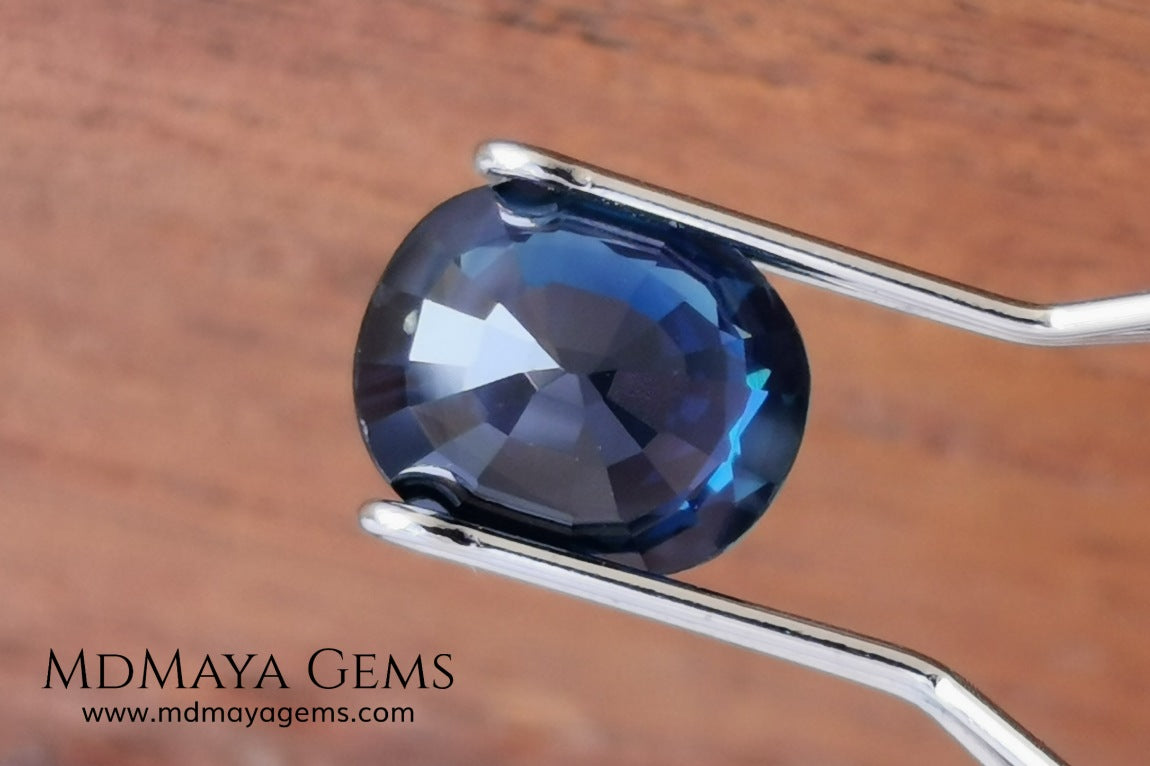 Untreated dark greenish blue sapphire 1.75 ct. Oval cut.  Amazing dark greenish blue sapphire with a good behavior under any type of light. It has a good size, and it will look perfect on your personalized jewelry, either in a ring or a pendant. It has some inclusions that although they are visible from some angles, they do not affect its beautiful at all. This amazing sapphire is ideal for those who look for precious stones without treatment of any kind.
